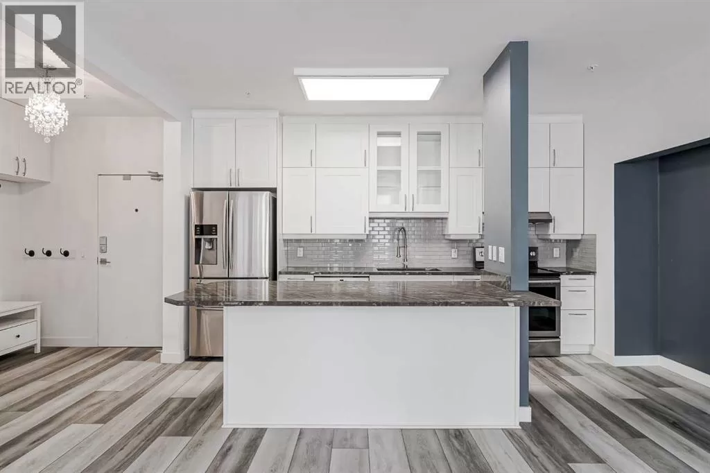 Apartment for rent: 102, 1410 2 Street Sw, Calgary, Alberta T2R 1R1