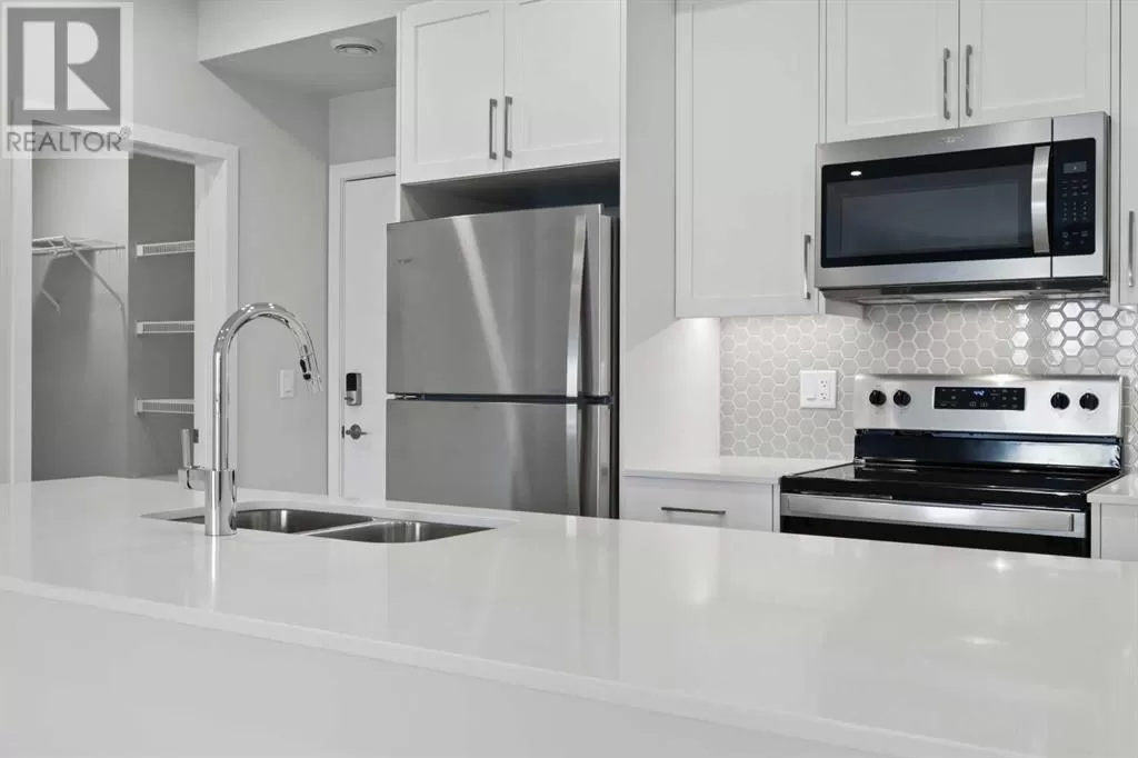 Apartment for rent: 310, 255 Les Jardins Park Se, Calgary, Alberta T2C 5V3